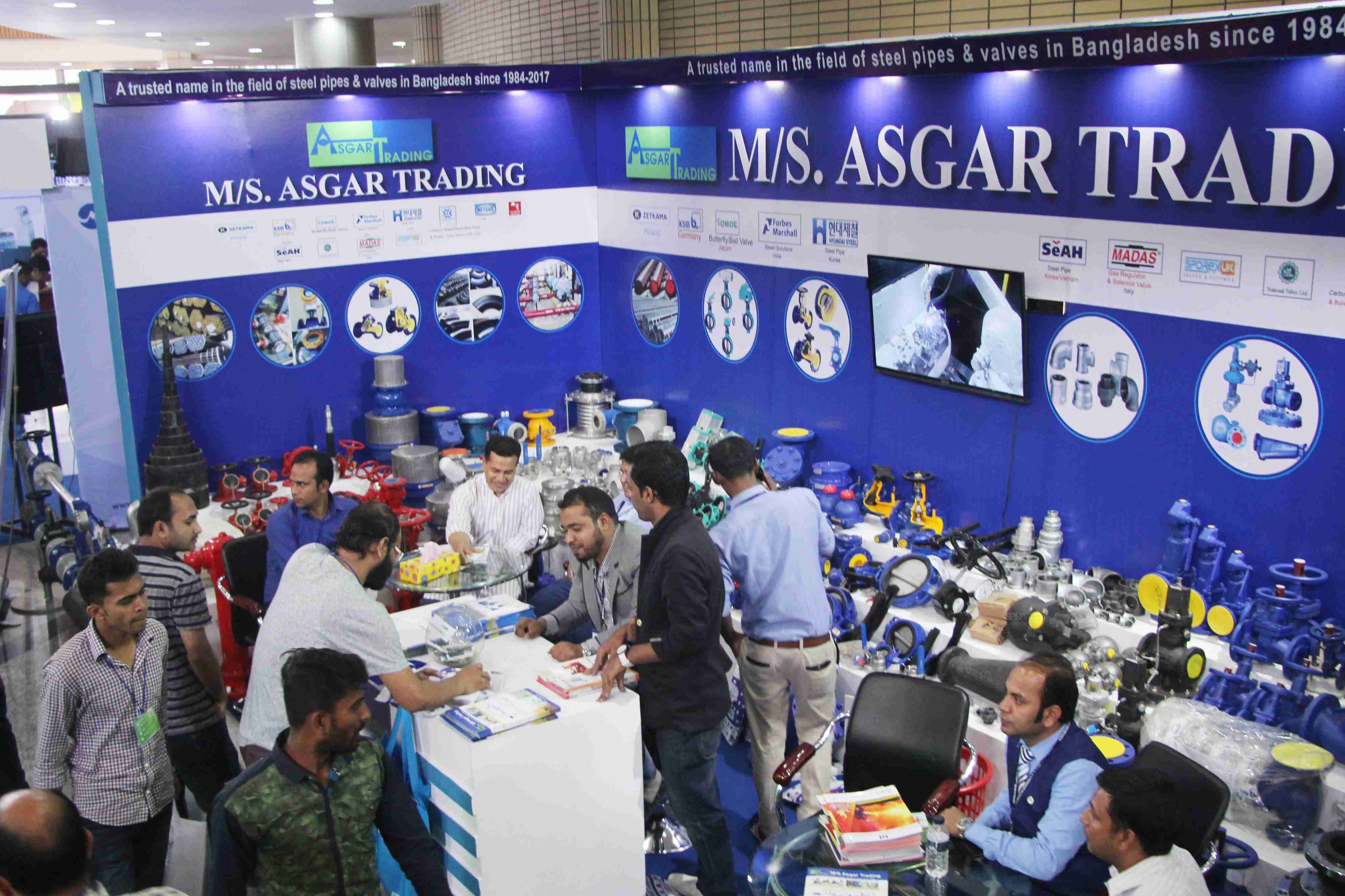 Busy Asgar Trading booth with visitors and staff
